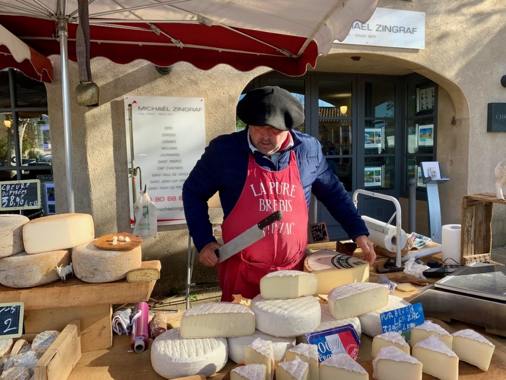 Cheese seller in the Lourmarin market, Luberon, Provence, France