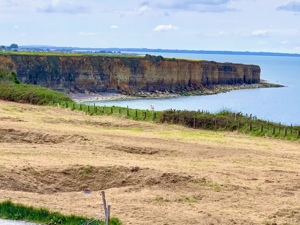 Cliffs scaled by the US rangers at Pointe-du-Hoc and the and craters created by allied bombardments