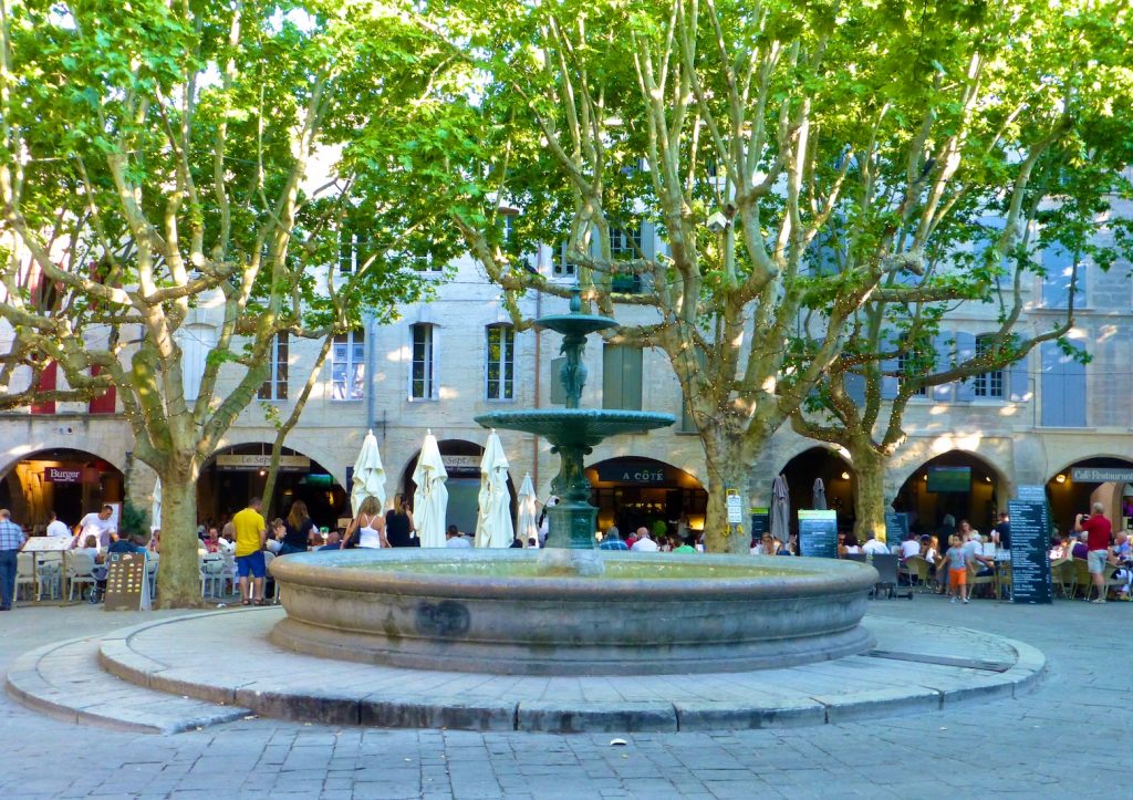 Provencal squares lined with cafes and dominated by majestic fountains