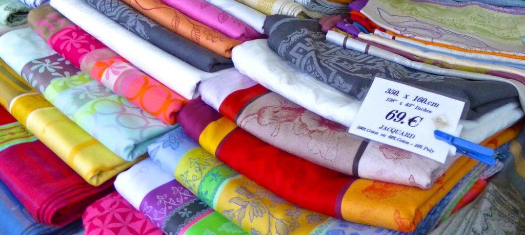 French table linens for sale in the Lourmarin Market, Lourmarin, Luberon, Provence, France