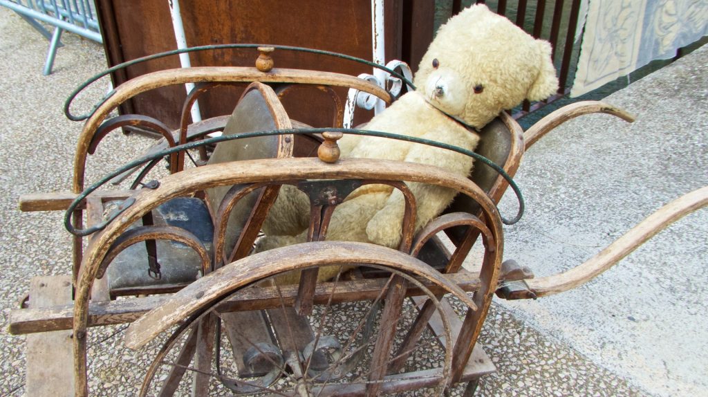 French Victorian push-chair for sale in Sunday Antiques market at L'IIse-sur-la-Sorgue, Luberon, Vaucluse, provence, France