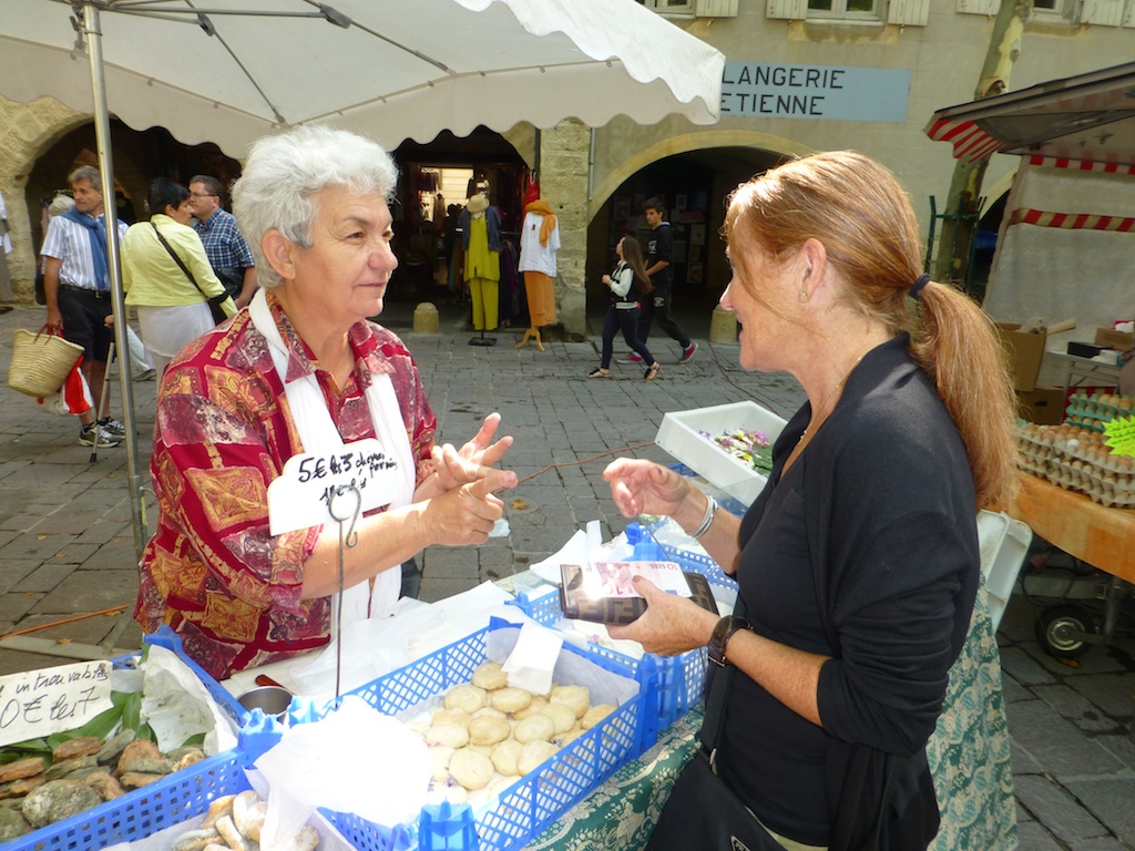 Goats cheese seller at Wednesday Market, Uzes, Languedoc Rousiilon, France