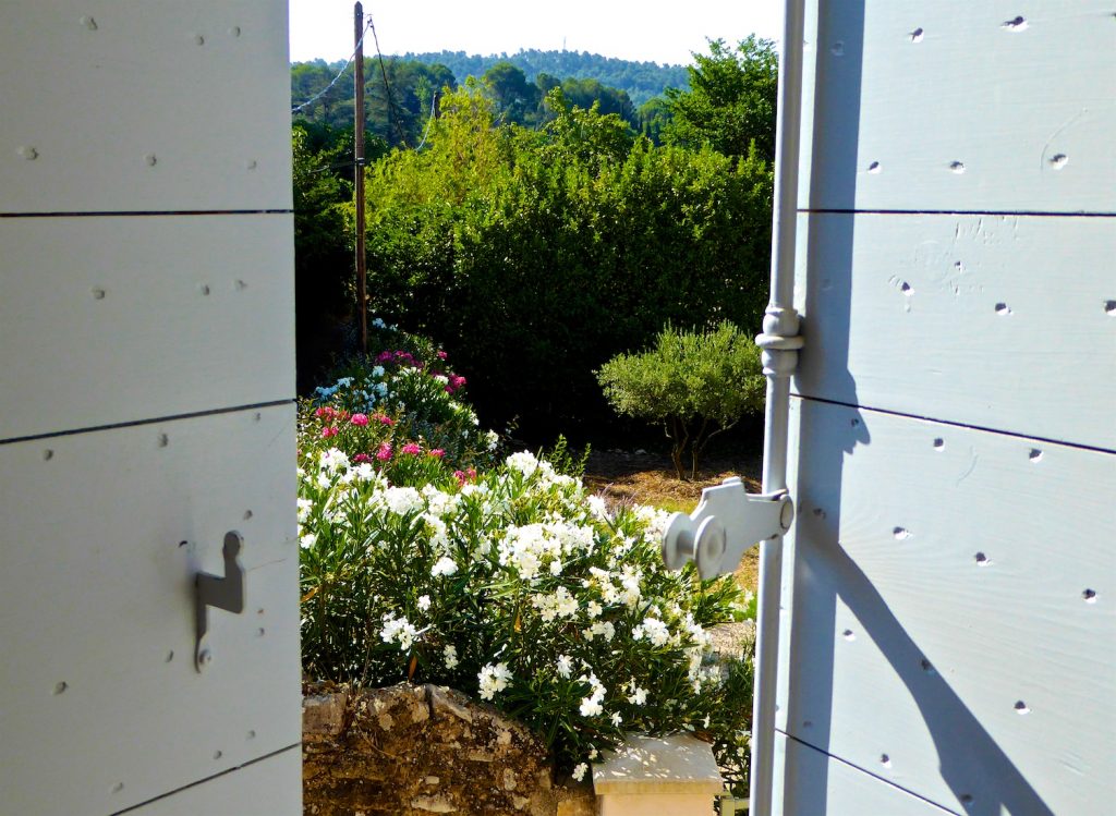 Open shutters of Provence in Lourmarin