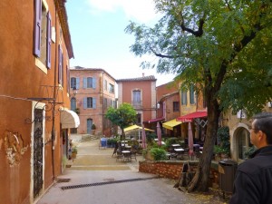 Ochre coloured buildings in a Rousillon's market square in Provence, France