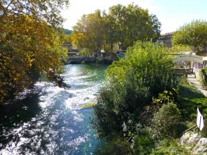 The rushing waters of the River Sorgue in Fontaine de Vaucluse, Provence, France