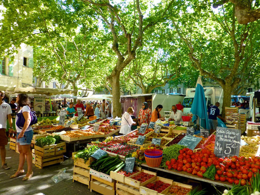 Plan your stay in Lourmarin visit the Uzes Market, Place aux Herbes, Uzes, Languedoc Roussillon, France